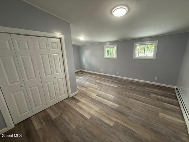 1338 Crane St, Schenectady, NY 12303 - unfurnished bedroom featuring a baseboard radiator, wood finished floors, a closet, and ornamental molding
