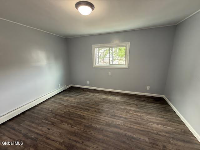 1338 Crane St, Schenectady, NY 12303 - unfurnished room with dark wood-style floors, crown molding, and a baseboard heating unit