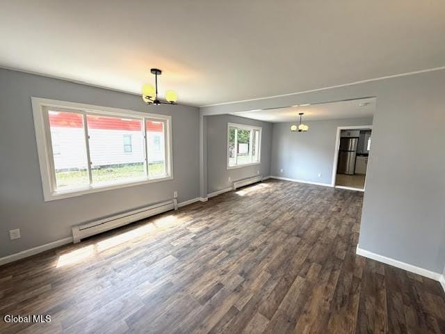 1338 Crane St, Schenectady, NY 12303 - unfurnished room featuring a chandelier, a baseboard heating unit, and dark wood-style flooring