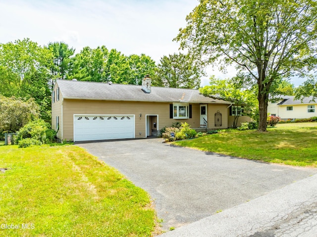 19 Drawbridge Dr, Guilderland, NY 12203 - view of front of house featuring a garage, asphalt driveway, a chimney, and a front lawn