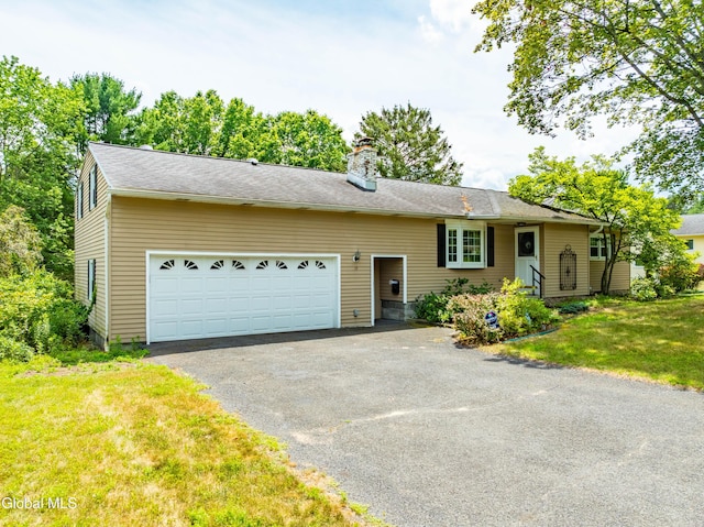 19 Drawbridge Dr, Guilderland, NY 12203 - view of front of house with asphalt driveway, an attached garage, a chimney, and a front lawn