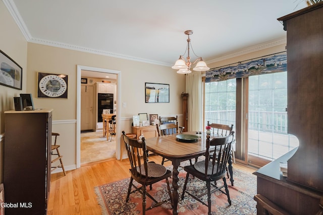 19 Drawbridge Dr, Guilderland, NY 12203 - dining room featuring ornamental molding, light wood-type flooring, and a chandelier