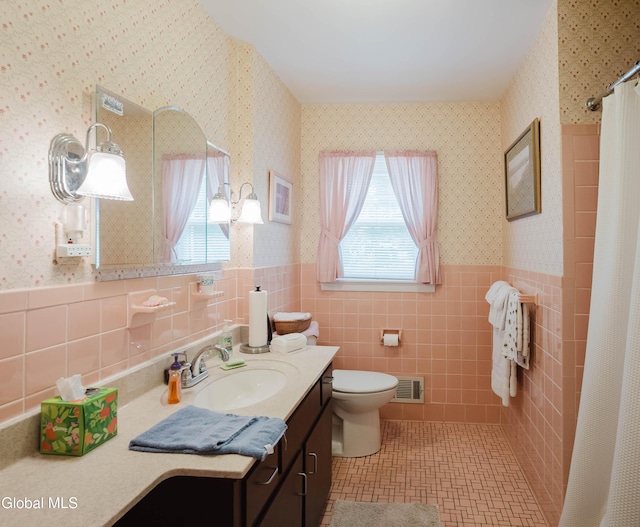 19 Drawbridge Dr, Guilderland, NY 12203 - bathroom with wallpapered walls, a wainscoted wall, vanity, tile patterned floors, and a shower with curtain