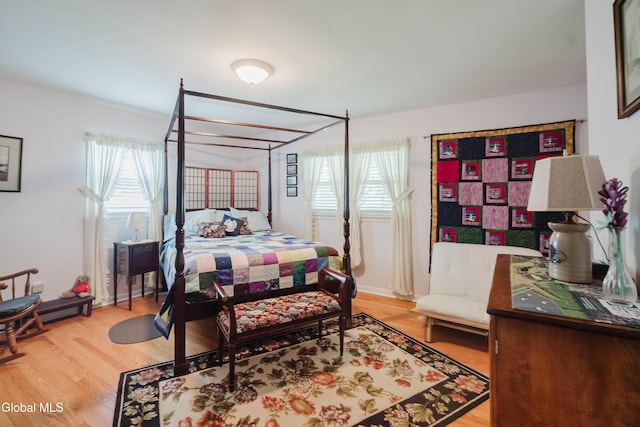 19 Drawbridge Dr, Guilderland, NY 12203 - bedroom with multiple windows and light wood-type flooring