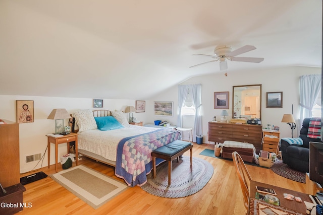 19 Drawbridge Dr, Guilderland, NY 12203 - bedroom featuring light wood finished floors, vaulted ceiling, and a ceiling fan