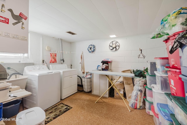 19 Drawbridge Dr, Guilderland, NY 12203 - laundry room featuring concrete block wall and washing machine and clothes dryer