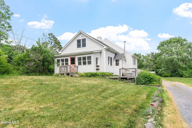 34 Old New Salem Rd, New Scotland, NY 12186 - view of front facade with a front lawn, a chimney, a deck, and driveway