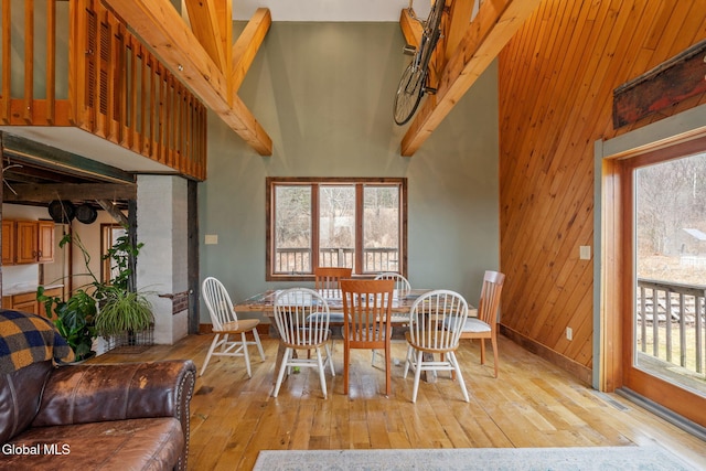 34 Old New Salem Rd, New Scotland, NY 12186 - dining area featuring light wood-style floors, healthy amount of natural light, and wood walls