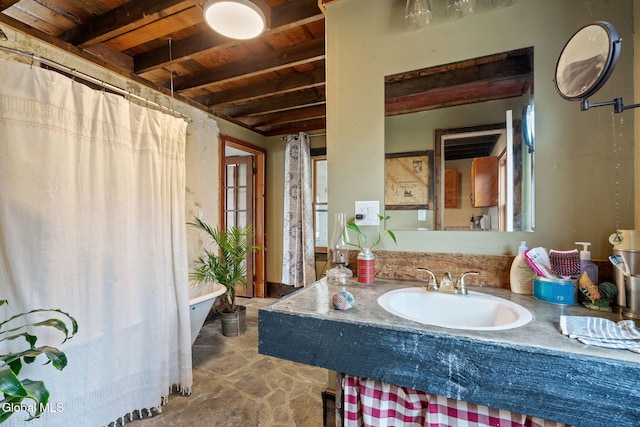34 Old New Salem Rd, New Scotland, NY 12186 - full bath featuring a wood ceiling with exposed beams, vanity, a shower with shower curtain, and stone finish flooring