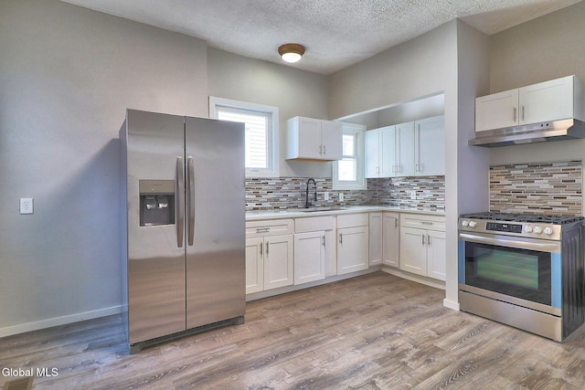 421 Summit Ave, Schenectady, NY 12307 - kitchen with stainless steel appliances, white cabinets, backsplash, and a textured ceiling