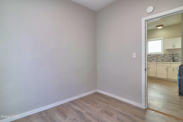 421 Summit Ave, Schenectady, NY 12307 - unfurnished room featuring light wood-style flooring and a smoke detector