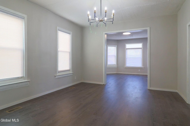 421 Summit Ave, Schenectady, NY 12307 - unfurnished room featuring a chandelier, dark wood-type flooring, and healthy amount of natural light