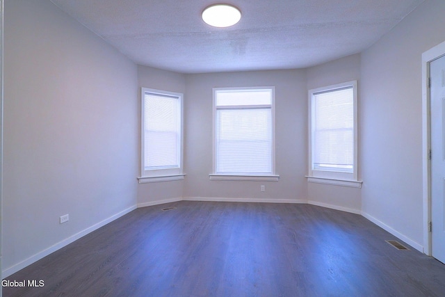 421 Summit Ave, Schenectady, NY 12307 - unfurnished room featuring dark wood-type flooring and a textured ceiling