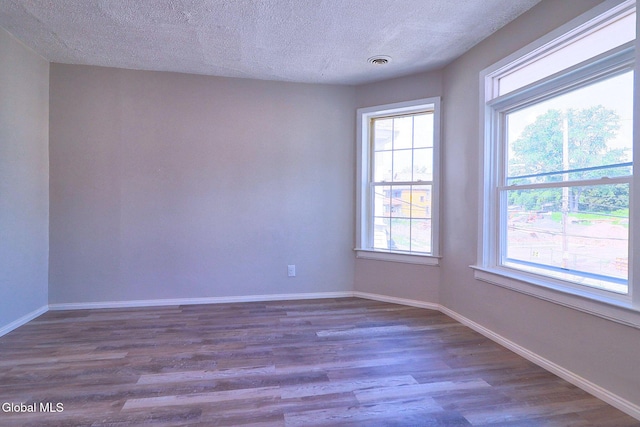 421 Summit Ave, Schenectady, NY 12307 - unfurnished room with dark wood-type flooring and a textured ceiling