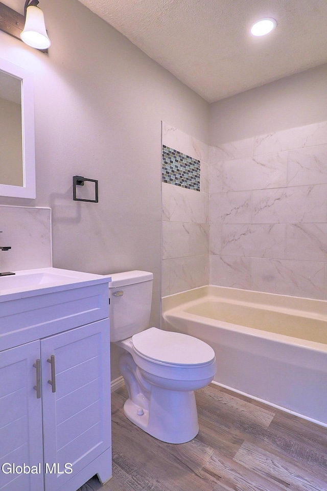 421 Summit Ave, Schenectady, NY 12307 - bathroom with wood finished floors, vanity, recessed lighting, shower / washtub combination, and a textured ceiling