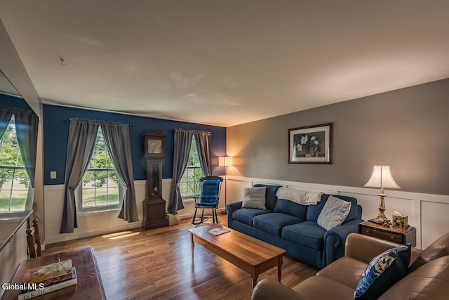 54 S Whitney Rd, Stillwater, NY 12866 - living area with wood finished floors, a wainscoted wall, and a decorative wall