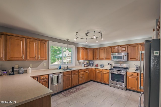 54 S Whitney Rd, Stillwater, NY 12866 - kitchen featuring stainless steel appliances, brown cabinets, light countertops, and light tile patterned floors