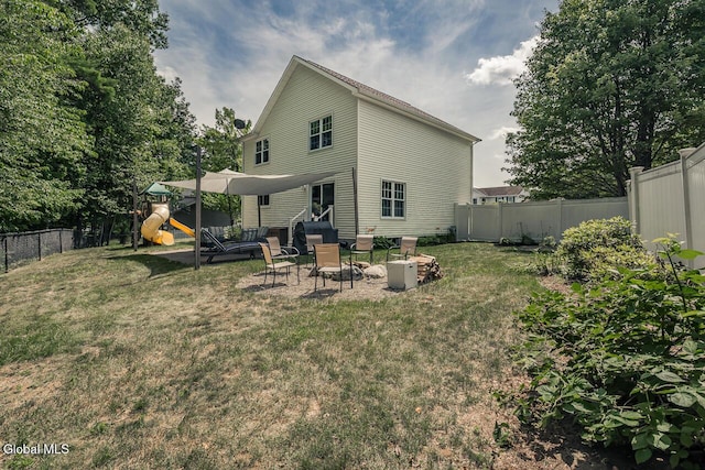 54 S Whitney Rd, Stillwater, NY 12866 - rear view of house featuring a playground and a fenced backyard