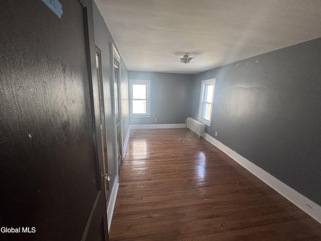 261 Altamont Ave, Schenectady, NY 12304 - spare room featuring wood finished floors and radiator