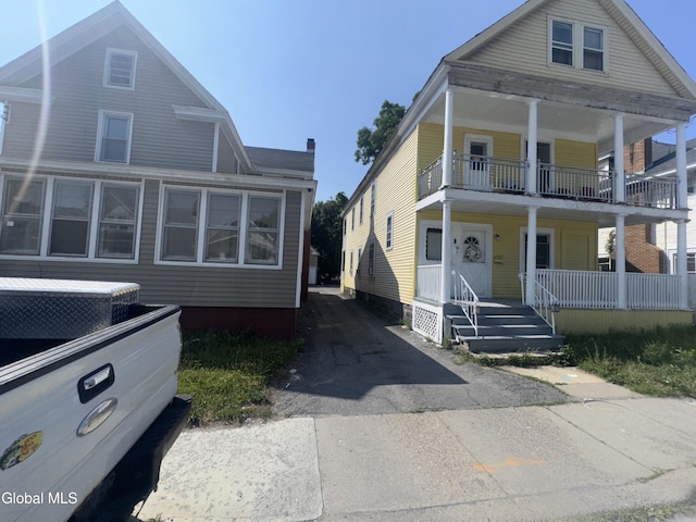 261 Altamont Ave, Schenectady, NY 12304 - view of front of house with covered porch and a balcony