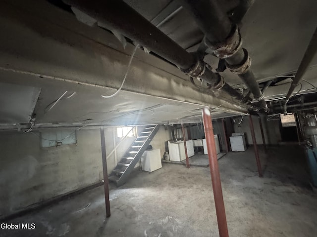 261 Altamont Ave, Schenectady, NY 12304 - unfinished basement with stairs and washer / clothes dryer