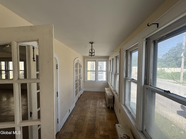 261 Altamont Ave, Schenectady, NY 12304 - unfurnished sunroom featuring radiator heating unit