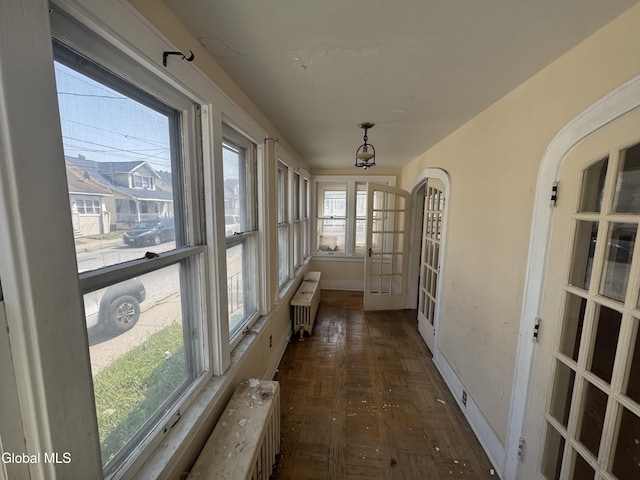 261 Altamont Ave, Schenectady, NY 12304 - unfurnished sunroom featuring radiator heating unit and french doors