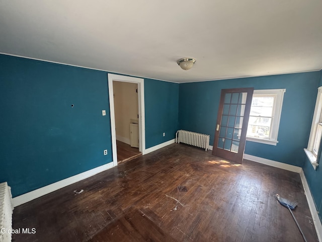 261 Altamont Ave, Schenectady, NY 12304 - empty room featuring radiator heating unit and wood-type flooring