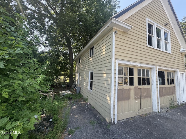 261 Altamont Ave, Schenectady, NY 12304 - view of property exterior featuring a garage