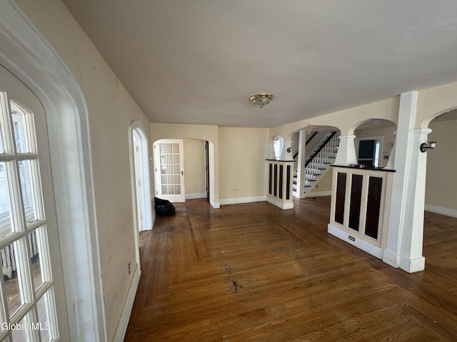 261 Altamont Ave, Schenectady, NY 12304 - hall featuring arched walkways, decorative columns, and stairs