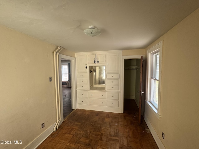 261 Altamont Ave, Schenectady, NY 12304 - unfurnished bedroom with multiple windows and a closet