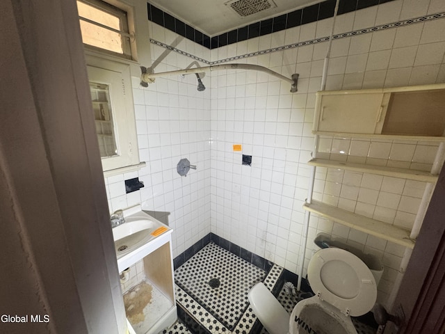 261 Altamont Ave, Schenectady, NY 12304 - full bath with tile walls, a shower stall, and tile patterned flooring