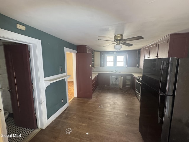 261 Altamont Ave, Schenectady, NY 12304 - kitchen featuring freestanding refrigerator, ceiling fan, dark wood finished floors, stainless steel gas range, and light countertops