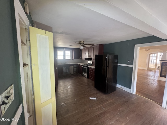 261 Altamont Ave, Schenectady, NY 12304 - kitchen with freestanding refrigerator, gas range, dark wood-type flooring, and a ceiling fan