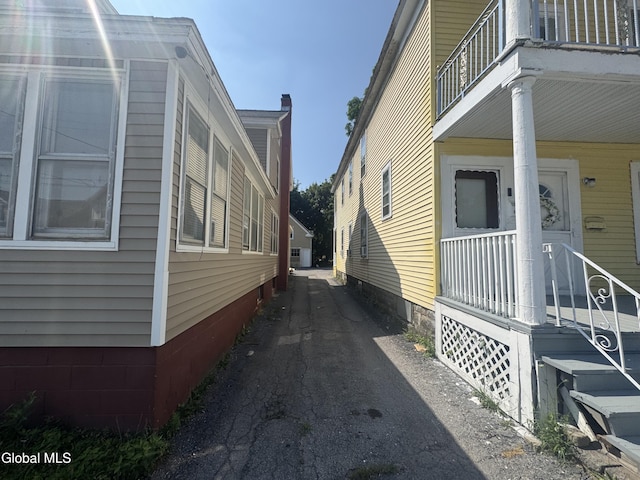 261 Altamont Ave, Schenectady, NY 12304 - view of home's exterior with a balcony and driveway