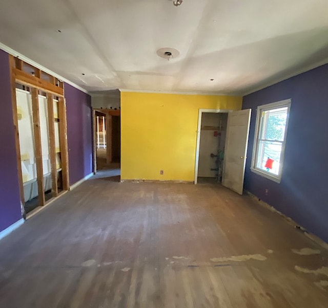 unfurnished room featuring dark wood-type flooring