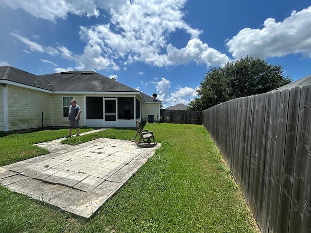 5175 Calvary Cir, Valdosta, GA 31605 - fenced backyard featuring a sunroom and a patio area