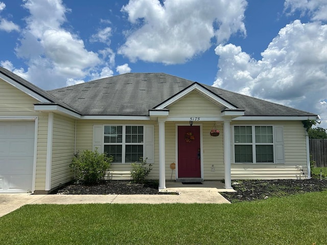 5175 Calvary Cir, Valdosta, GA 31605 - view of front of property featuring an attached garage, a front yard, roof with shingles, and covered porch
