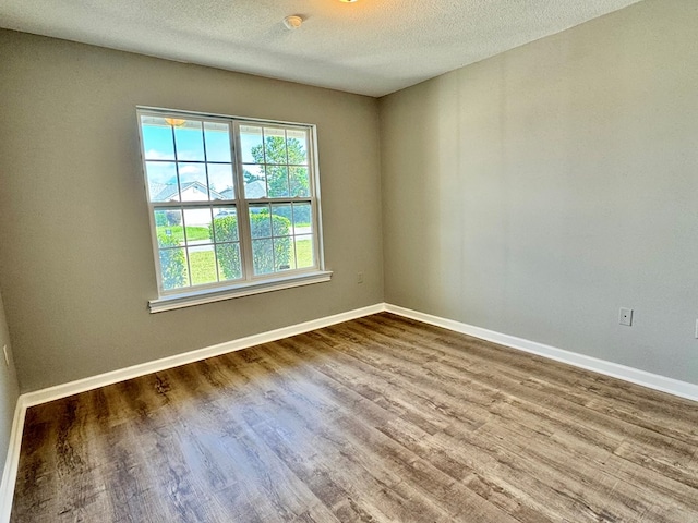 5341 Branch Pt, Valdosta, GA 31605 - spare room with wood finished floors and a textured ceiling
