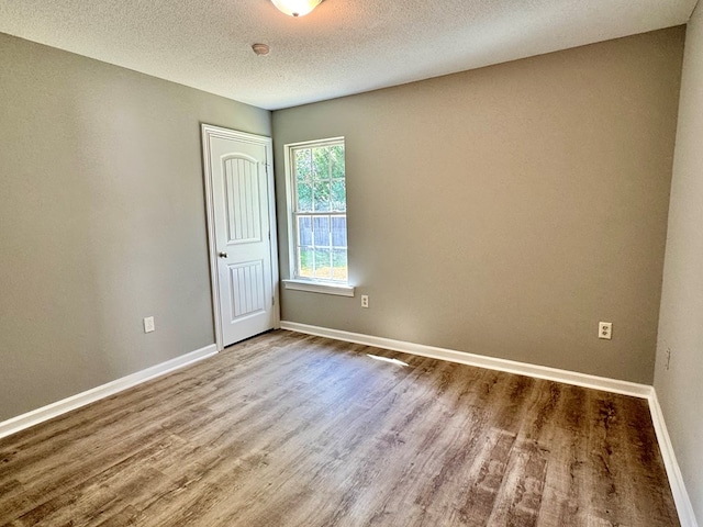 5341 Branch Pt, Valdosta, GA 31605 - spare room with wood finished floors and a textured ceiling