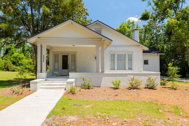 1611 N Patterson St, Valdosta, GA 31602 - view of front of home with a chimney and covered porch
