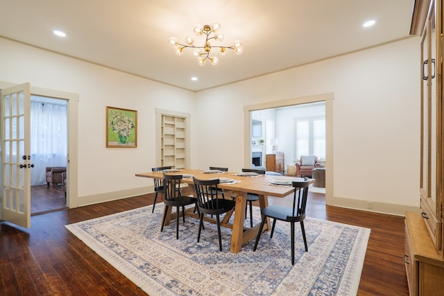 1611 N Patterson St, Valdosta, GA 31602 - dining area with french doors, a chandelier, dark wood-style flooring, and recessed lighting