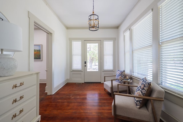 1611 N Patterson St, Valdosta, GA 31602 - foyer with dark wood finished floors, a chandelier, and ornamental molding