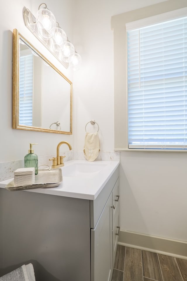 1611 N Patterson St, Valdosta, GA 31602 - bathroom featuring vanity and wood finished floors