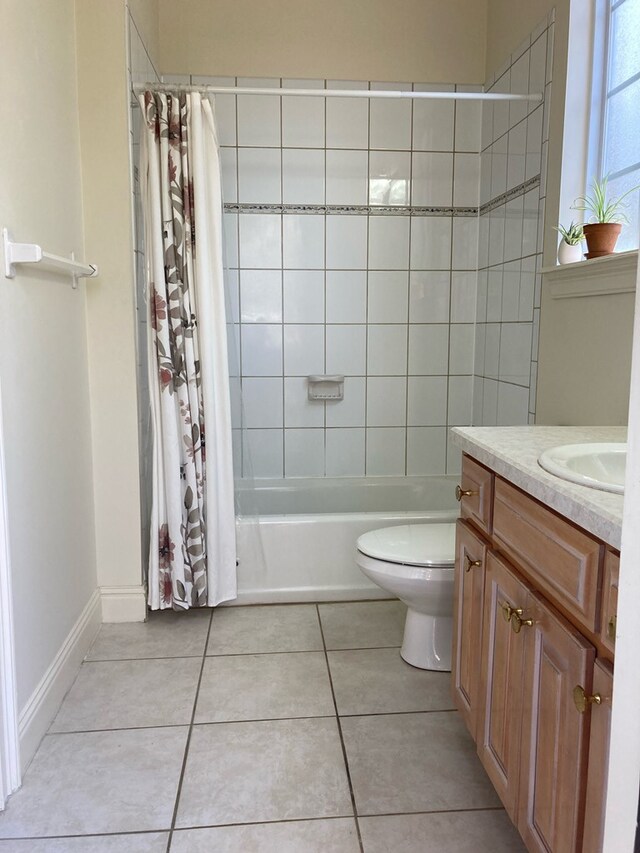 full bathroom with tile patterned flooring, vanity, shower / bath combination with curtain, and toilet