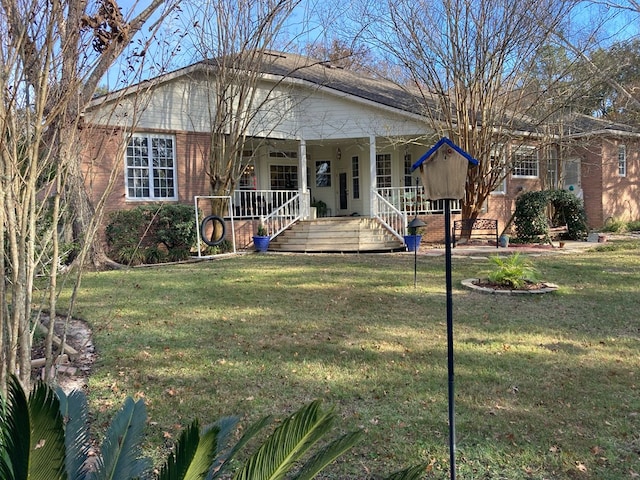 view of front of property featuring a front lawn and covered porch