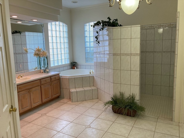 bathroom featuring tile patterned floors, ornamental molding, vanity, a chandelier, and shower with separate bathtub