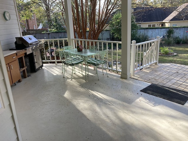 view of patio with a grill