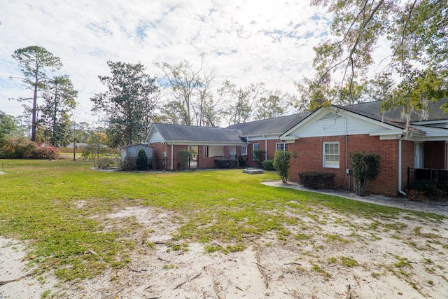 rear view of property with a yard