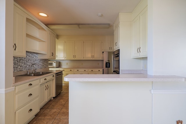 kitchen featuring sink, tasteful backsplash, stainless steel dishwasher, tile patterned floors, and kitchen peninsula